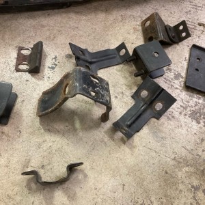 Swap meet finds: got a whole pile of CJ7 swing out spare tire brackets for $5. Not sure about that one on the right...